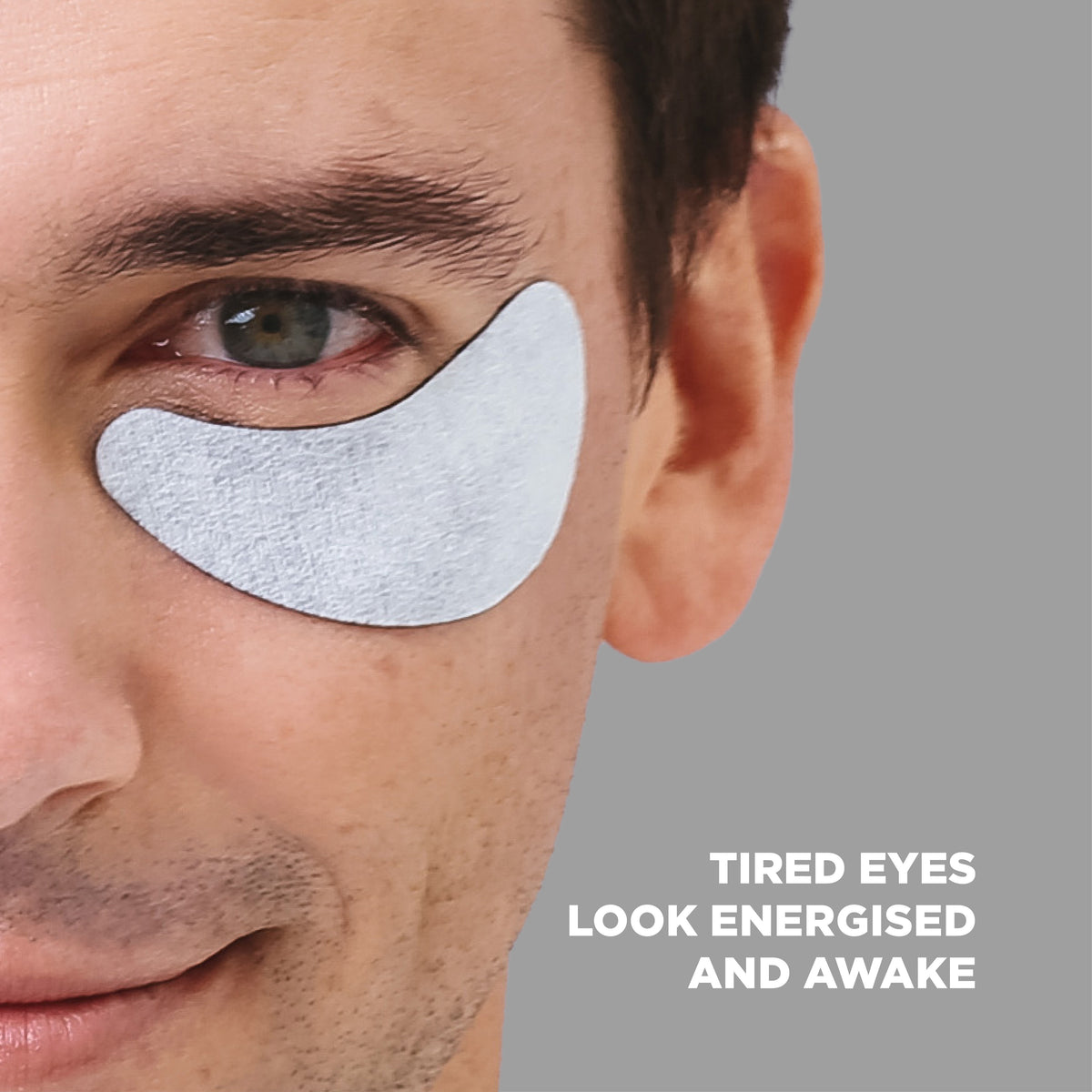 Man wearing charcoal under eye mask: tired eyes look energised and awake